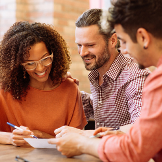person talking to a banker or teller at a credit union or bank