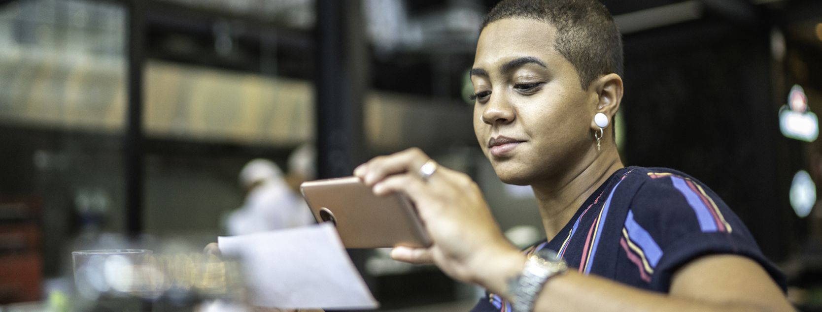 Woman depositing a check into her Patelco free checking account using the mobile app