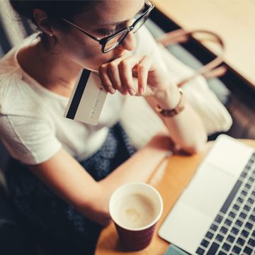 Person vigilantly using their credit card online and at their computer