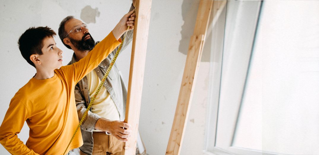 A father and son tackle a home improvement project.