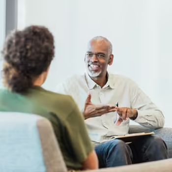 A Patelco advisor discusses auto insurance policies with a member.