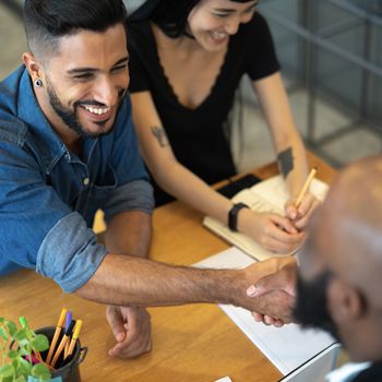 Two people shaking hands.