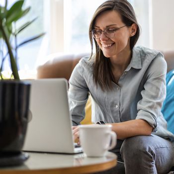 Person on laptop with coffee