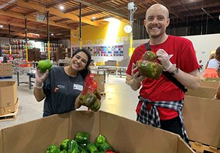 Patelco Team Members sorting food at Alameda County Community Food Bank.