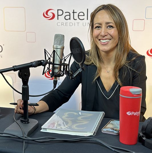 Patelco employee Michele Enriquez at the podcast desk
