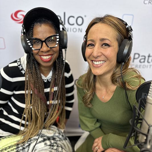 Patelco employees Michele Enriquez and Veronica Dangerfield at the podcast desk