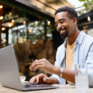 person at laptop looking confident