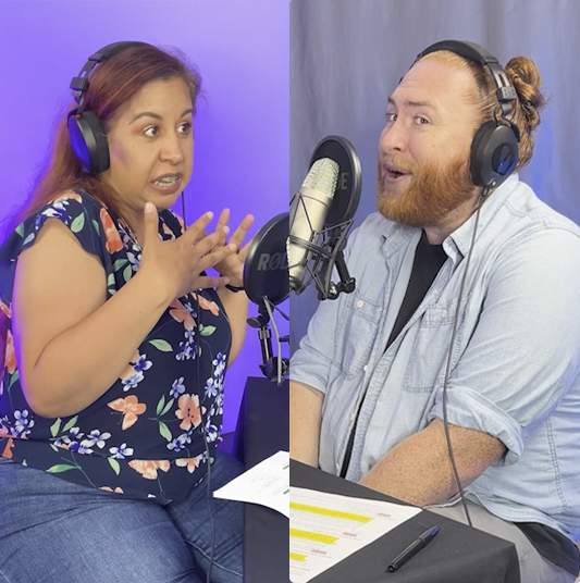Patelco employees Erika Karamanos and Andrew Farrell speaking into microphones at the podcast desk.